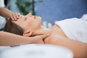 Woman Getting Shoulder and Head Massage in Salon